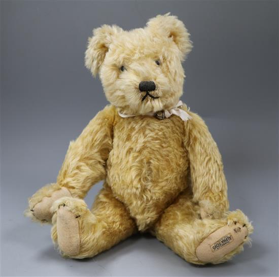 A 1930s Farnell teddy bear, Arthur, with golden curly mohair, clear and black glass eyes, pronounced snout, black